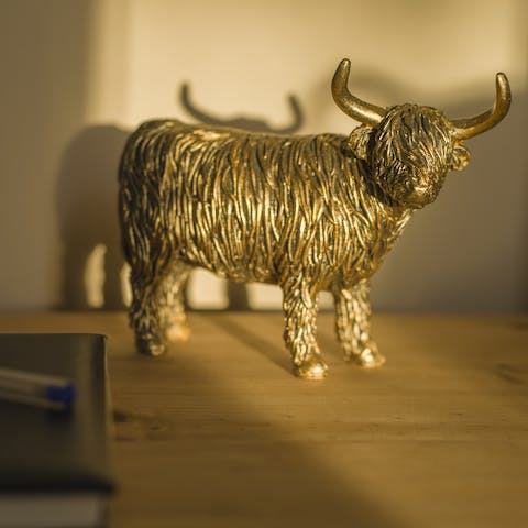 Enjoy little local decor touches like brass highland coos