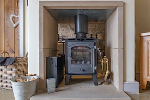 Curl up on the Velvet sofa or in bed in front of the double sided log-burner,