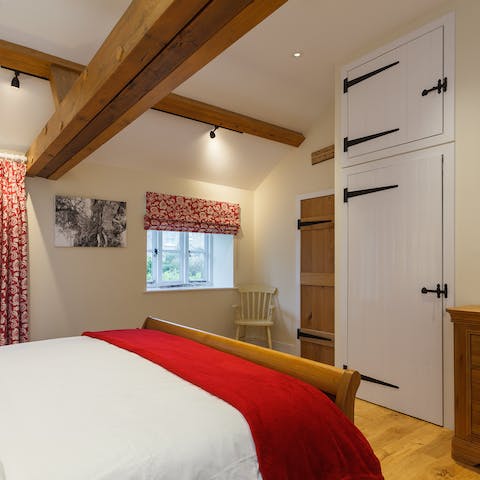 Admire original features such as timber beams and barn-style doors