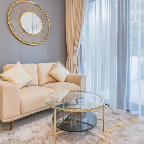 Get cosy in the stylish lounge area and enjoy a movie night with your travel companion