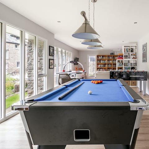 Stay entertained in the communal games room featuring a pool table, air hockey and table football