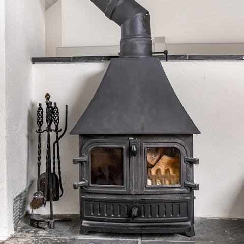 Snuggle up around the wood burner fire, after a long country walk to Bovey Tracey village
