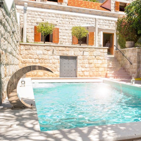 Dive into the private swimming pool to keep cool