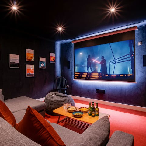Make a bowl of popcorn and snuggle up for movie night together in the cinema room