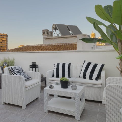 Enjoy a sundowner on the communal rooftop terrace
