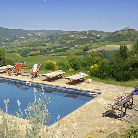 Enjoy sweeping views while relaxing by the pool