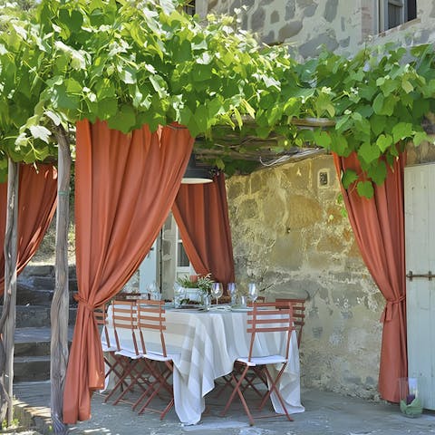 Savour local wine while dining on the terrace 