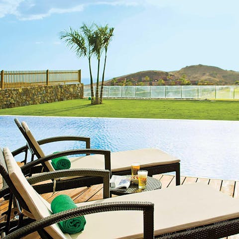 Soak up the sun and admire the views on a sun lounger
