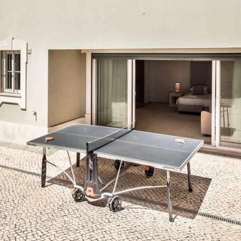 Play a game of table tennis in the sunshine