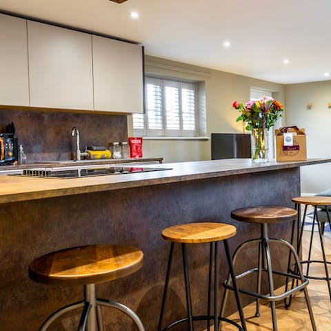Eat and chat at the kitchen island in the sociable living space