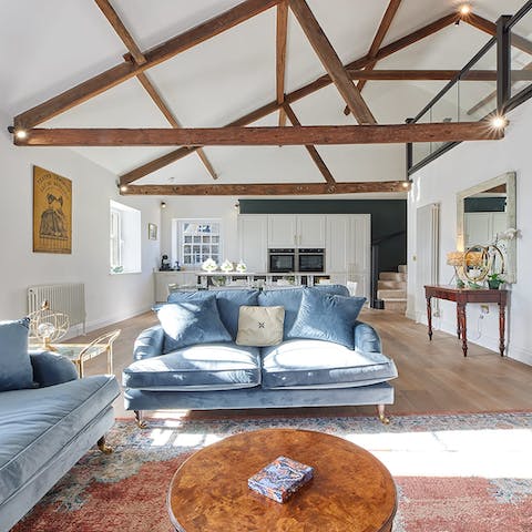 Make yourself at home in the bright and open living space, admiring the exposed beams