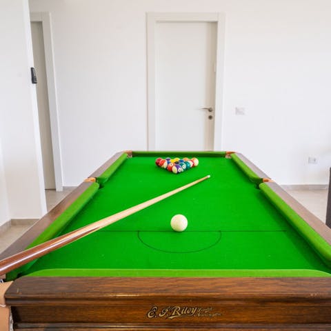 Show off your skills by challenging someone to a game of pool