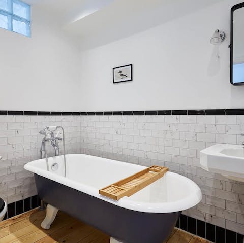 Take a relaxing bath in the claw-footed tub