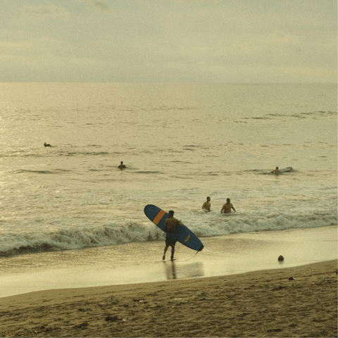 Catch some waves at Seminyak beach