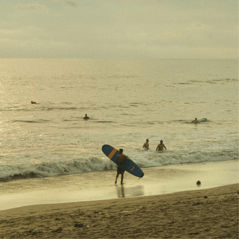 Catch some waves at Seminyak beach