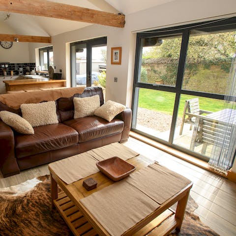 Bask in the natural light from floor-to-ceiling windows in the living room