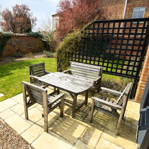 Gather at the table in the sunshine for meals outside or an evening drink