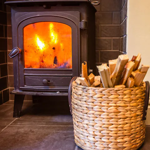 Cosy up around the wood-burning stove as evening draws in