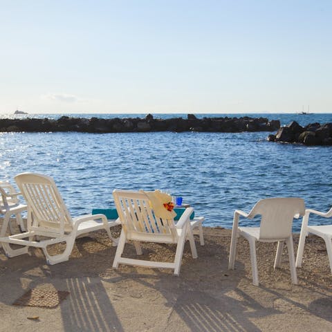 Take the steps from the lower terrace down to the sea