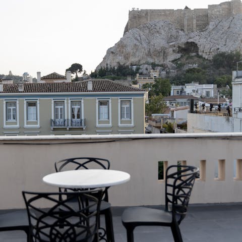 Sip a glass of Greek wine on the communal terrace while admiring views of the towering Acropolis