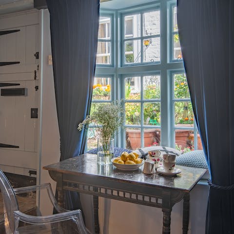Tuck into a hearty breakfast in the cute nook, enjoying the views of the flowery street