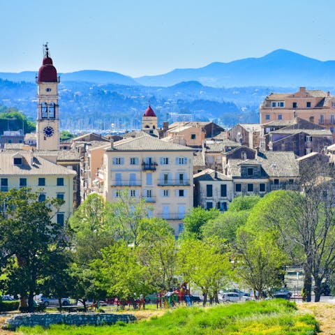 Drive twenty minutes to Corfu Town and explore the pretty cobbled streets