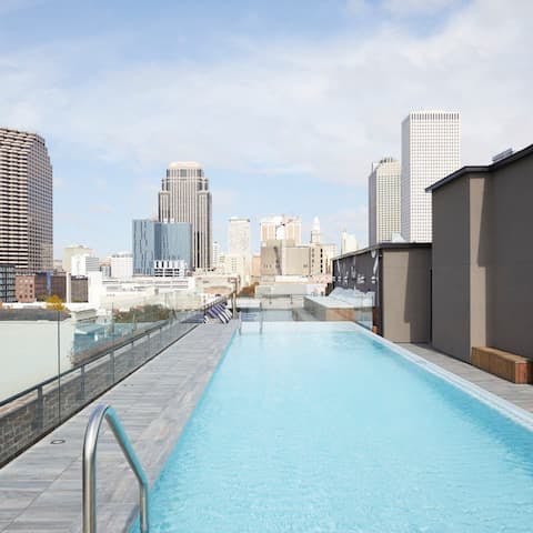 Take a dip in the pool overlooking the city skyline
