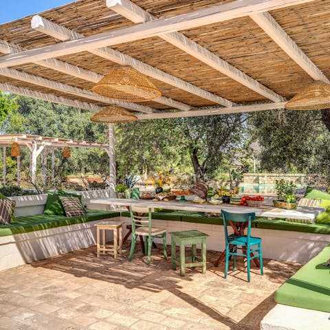 Share glasses of Barolo wine on the cute cushions under the pergola