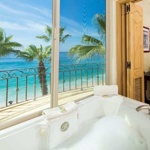 Sink into the depths of the jetted bathtub and enjoy a soak with a view