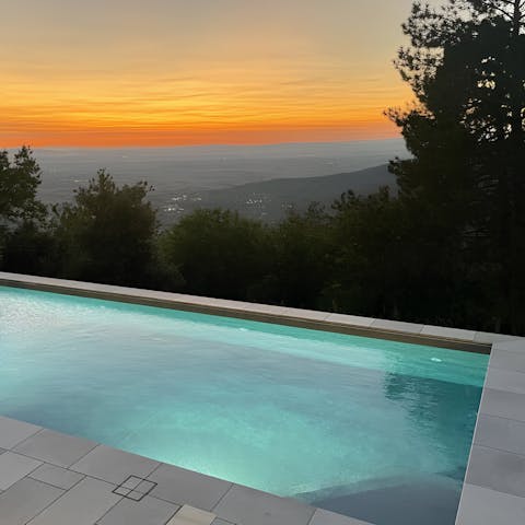 Enjoy a dip in the pool as the sun goes down
