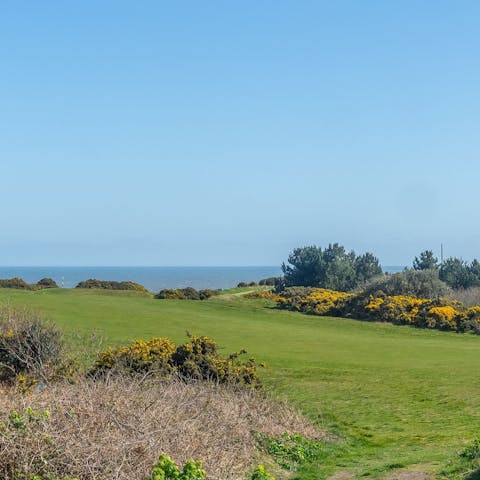 Admire the wonderful views across the golf course to the sea