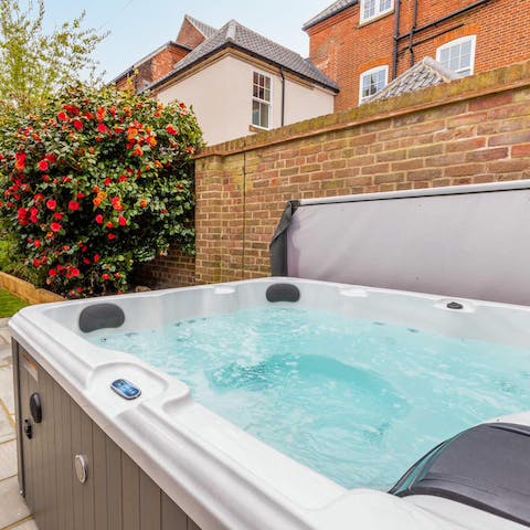 Unwind in the soothing bubbles of the hot tub