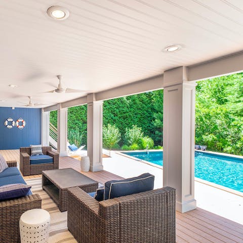 Spend sunny days between the pool and the shaded seating