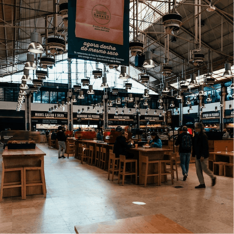 Get well acquainted with Lisbon's hottest street food vendors at Time Out Market, just ten minutes away on foot