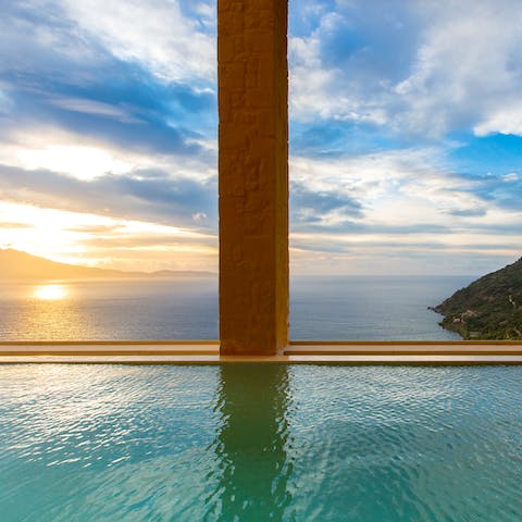 Cool off in your infinity pool while you gaze out at the ocean