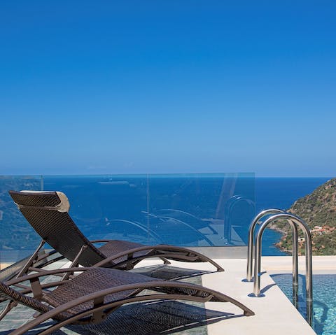 Sit out on your sunloungers while admiring views of the Aegean Sea