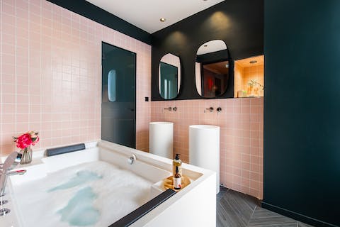 Unwind in the relaxing bubbles of the hot tub bath
