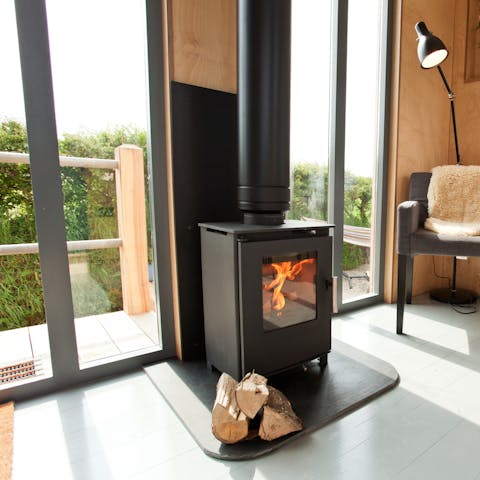 Cosy up beside the wood burning fire indoors