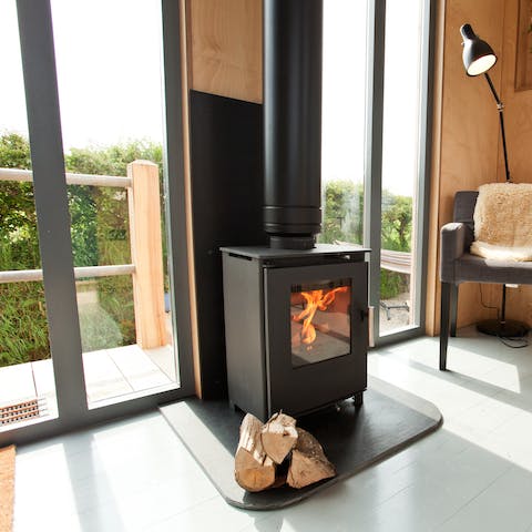 Cosy up beside the wood burning fire indoors