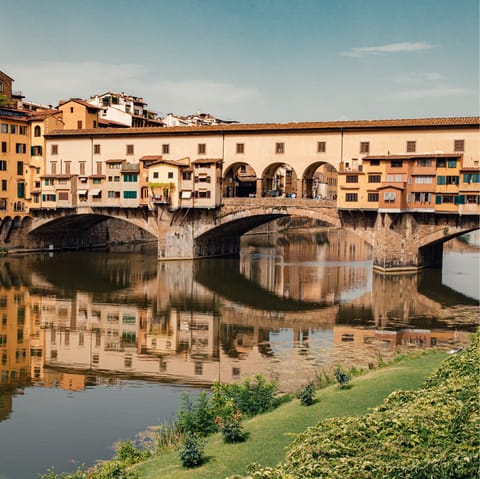Admire the Ponte Vecchio, less than a minute on foot from this home