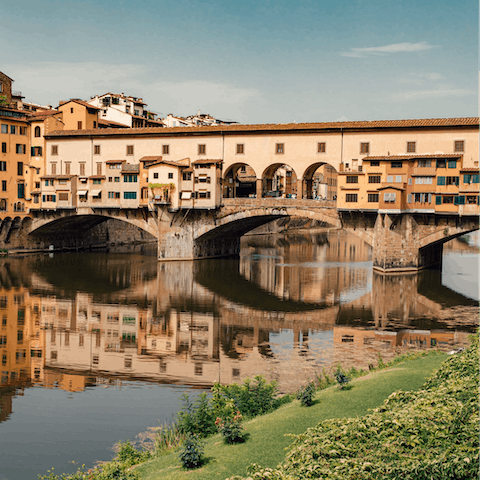 Admire the Ponte Vecchio, less than a minute on foot from this home