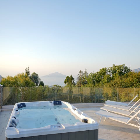 Slip into the bubbling hot tub on the roof for a view of the mountains