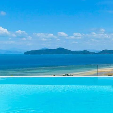 Swim to the edge of the infinity pool to take in the unbelievable view over the Gulf of Thailand