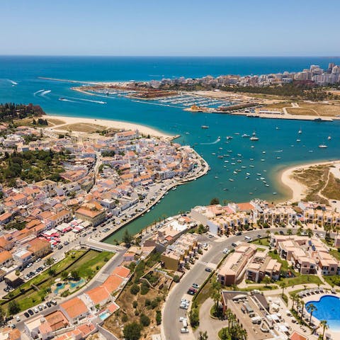 Explore the beautiful beaches in Ferragudo and experience the delicious local cuisine at the marina