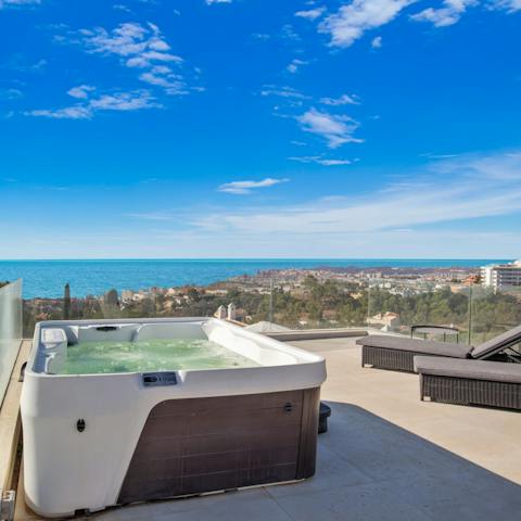 Relax in the Jacuzzi bubbles and look out at the perfect horizon