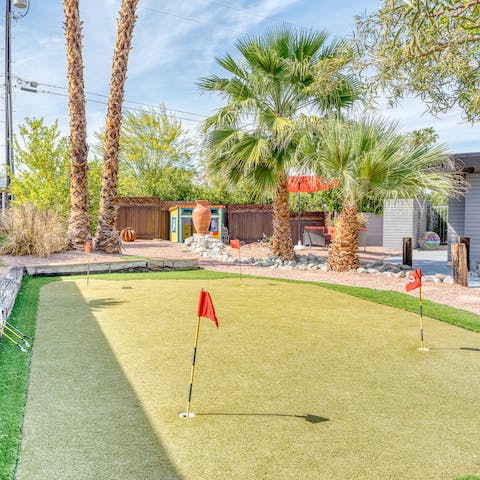 Try your hand at the home's four-hole putting green