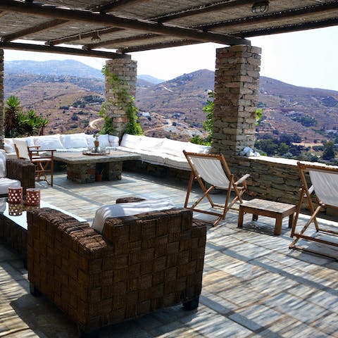 Share a bottle of ouzo on the private balcony, with lovely views