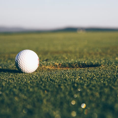 Tee off at the local golf club, a fifteen-minute drive away