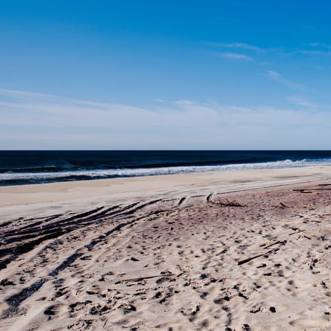 Feel the sand between your toes at Ponquogue Beach – it's just a five-minute drive from your front door