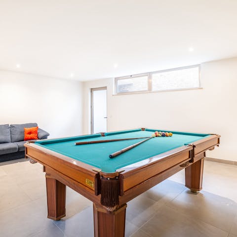 Get competitive with a few rounds of pool in the games room